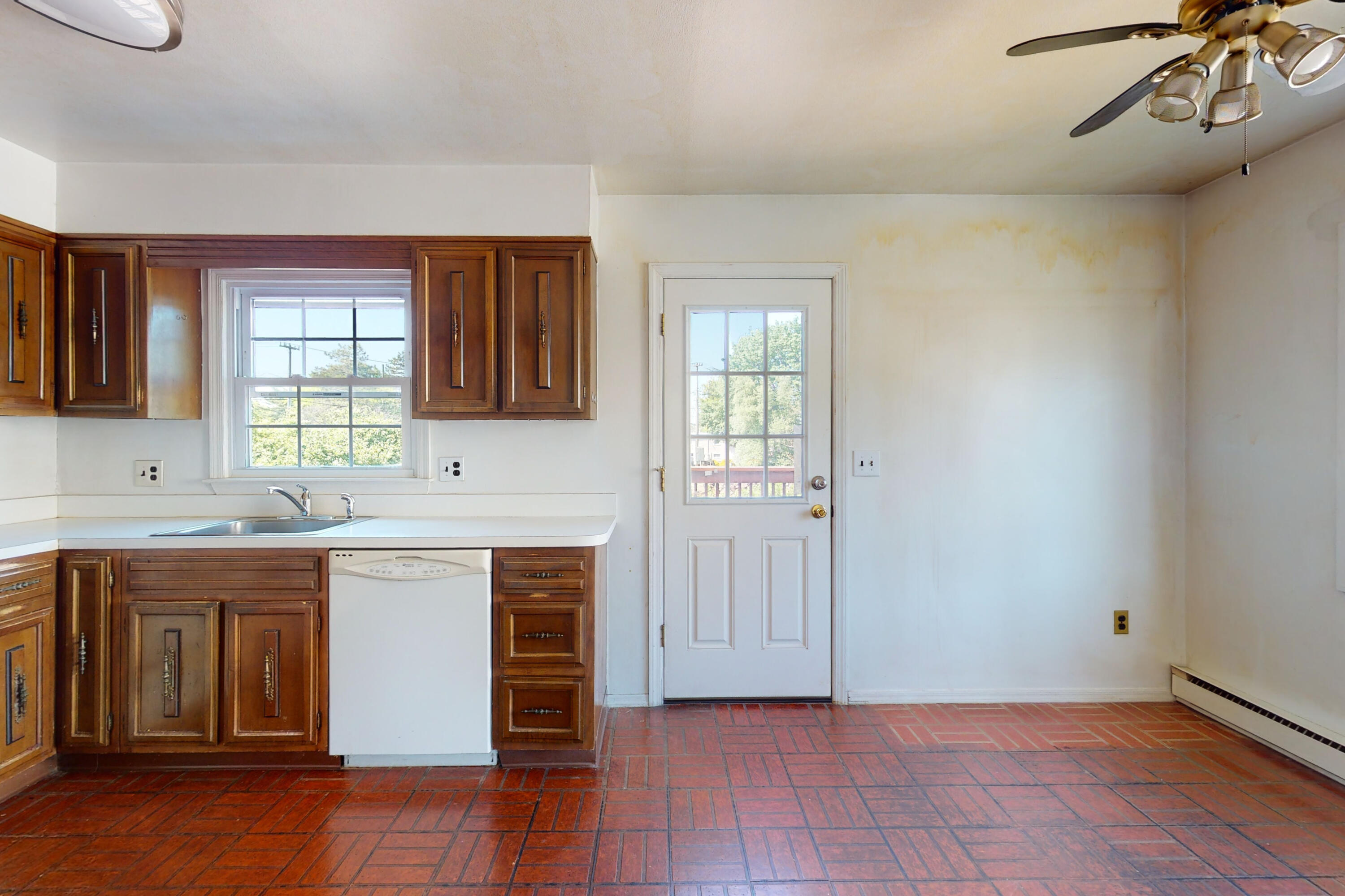 47 Mitchell Street Stamford, CT 06902 - Photo 7 of 22 an open kitchen with a sink and cabinets
