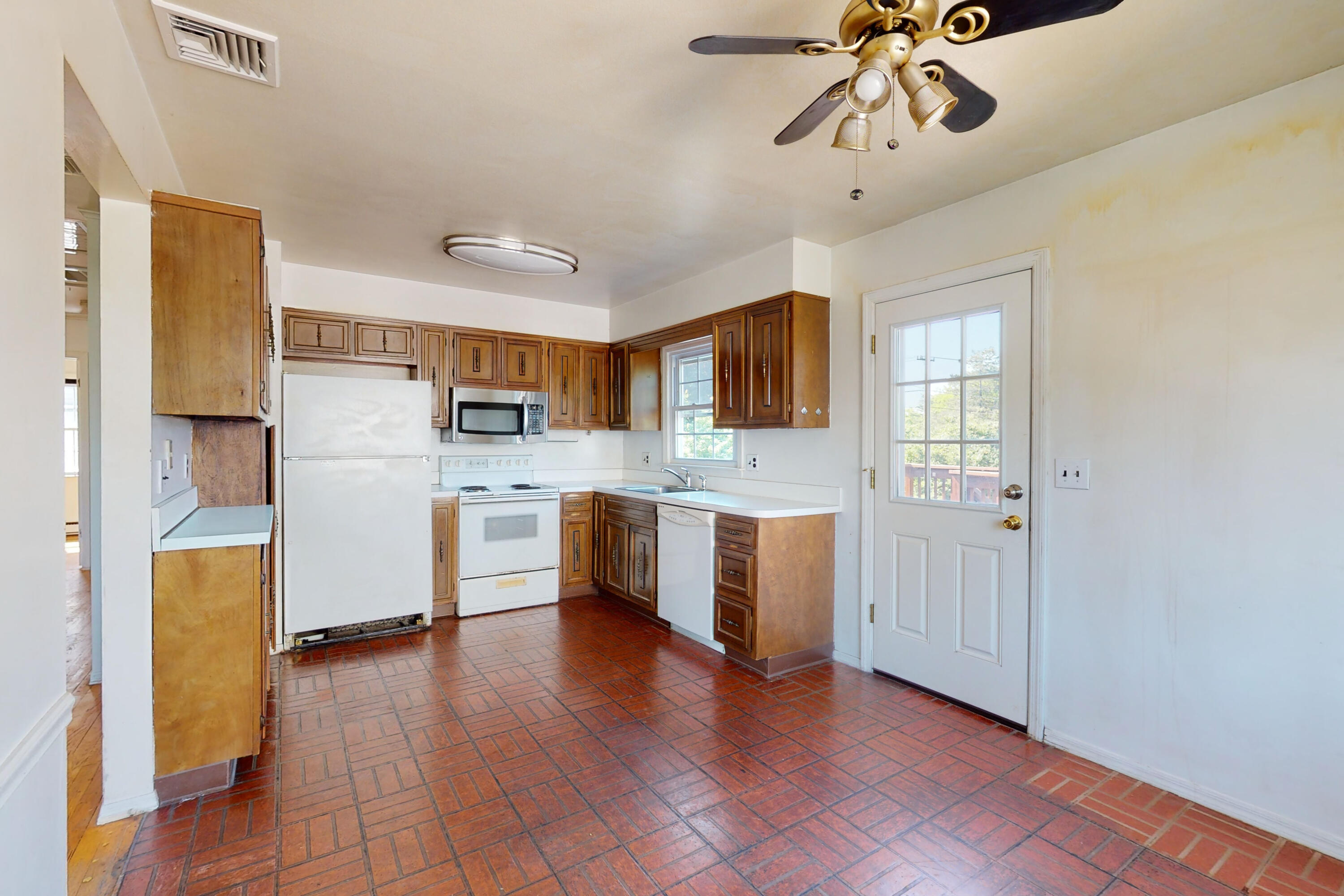 47 Mitchell Street Stamford, CT 06902 - Photo 8 of 22 a kitchen with stainless steel appliances a refrigerator sink and cabinets