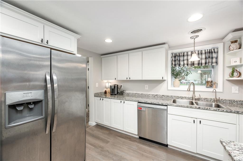 100 Blom Road Grove City, PA 16127 - Photo 11 of 31 a kitchen with a refrigerator sink and cabinets
