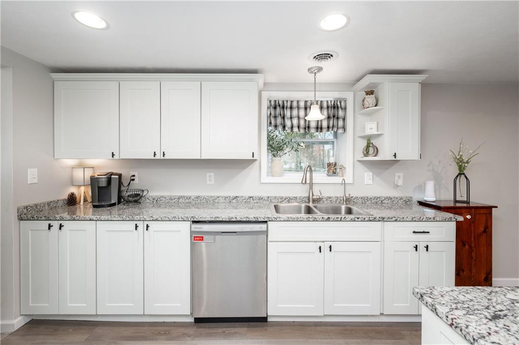 100 Blom Road Grove City, PA 16127 - Photo 12 of 31 a kitchen with granite countertop a sink stove and cabinets