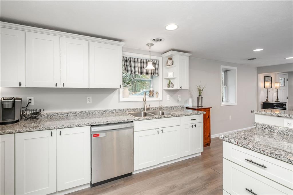 100 Blom Road Grove City, PA 16127 - Photo 13 of 31 a kitchen with granite countertop white cabinets and white appliances