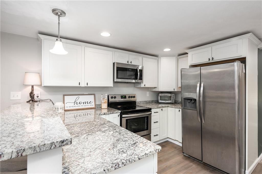 100 Blom Road Grove City, PA 16127 - Photo 15 of 31 a kitchen with kitchen island granite countertop stainless steel appliances and a sink
