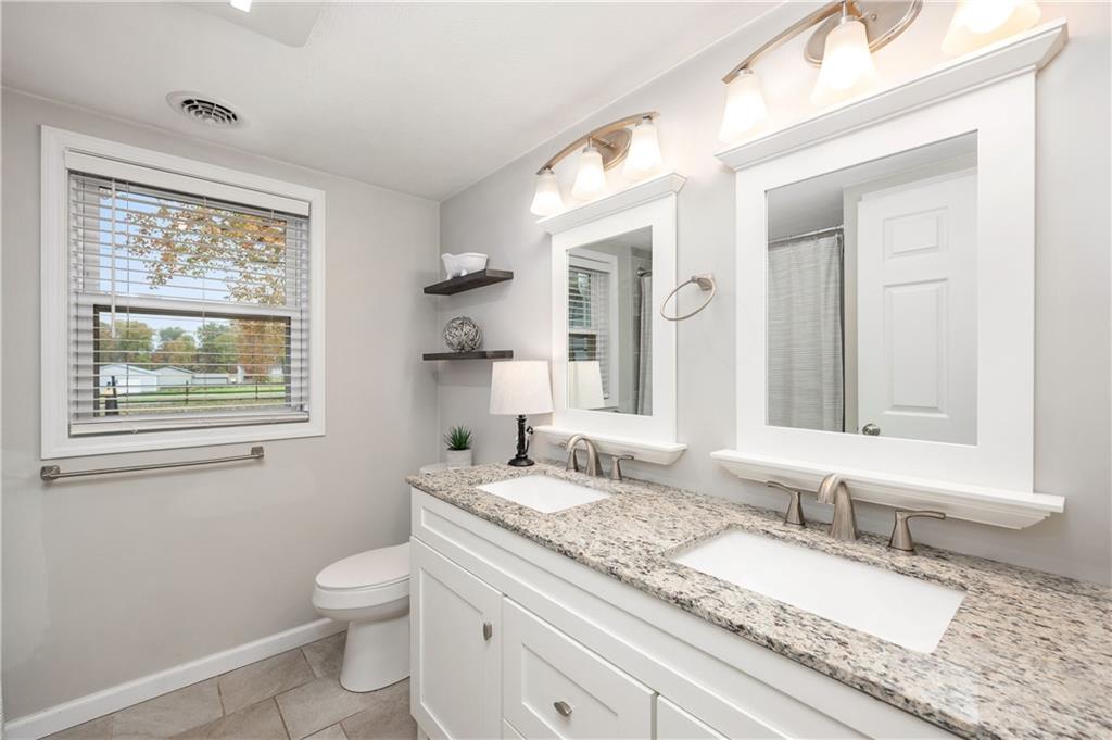 100 Blom Road Grove City, PA 16127 - Photo 18 of 31 a bathroom with a granite countertop sink mirror and a toilet