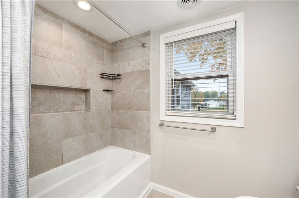 100 Blom Road Grove City, PA 16127 - Photo 19 of 31 a white bath tub sitting next to a window