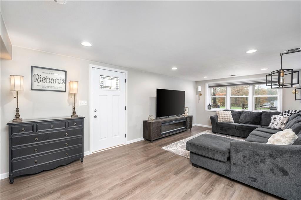 100 Blom Road Grove City, PA 16127 - Photo 2 of 31 a living room with furniture and a flat screen tv