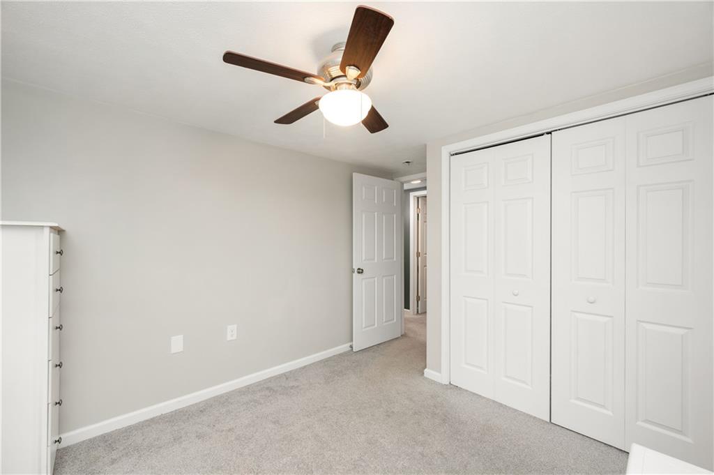 100 Blom Road Grove City, PA 16127 - Photo 23 of 31 an empty room with a ceiling fan and a window