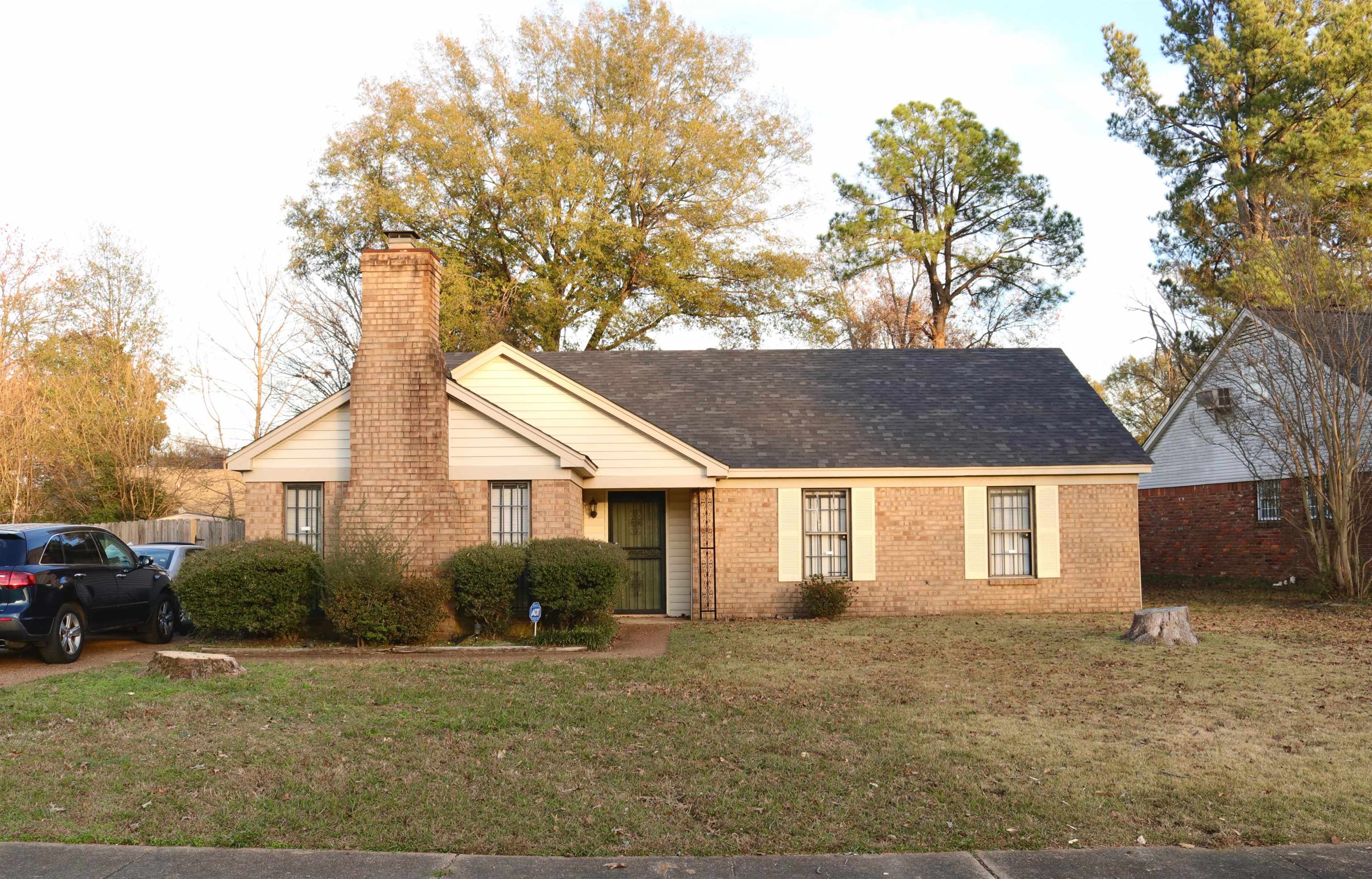 4418 Spring Park Drive Memphis, TN 38141 - Photo 1 of 12 a house that has a tree in front of it