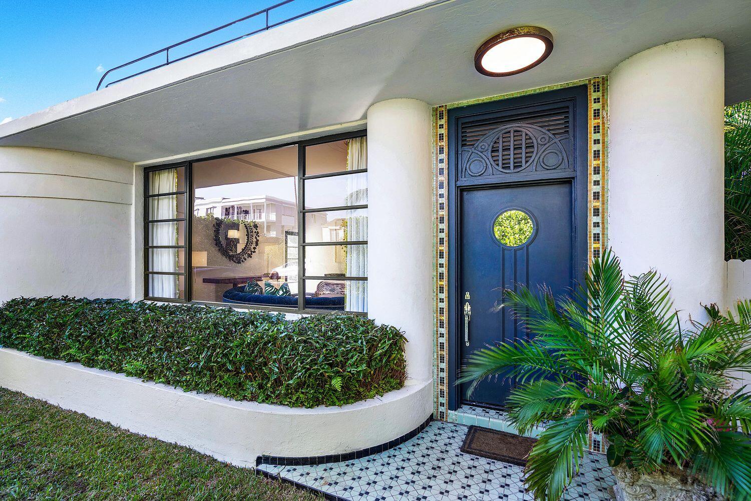 162 Peruvian Avenue Palm Beach, FL 33480 - Photo 2 of 41 a front view of a house with a garden