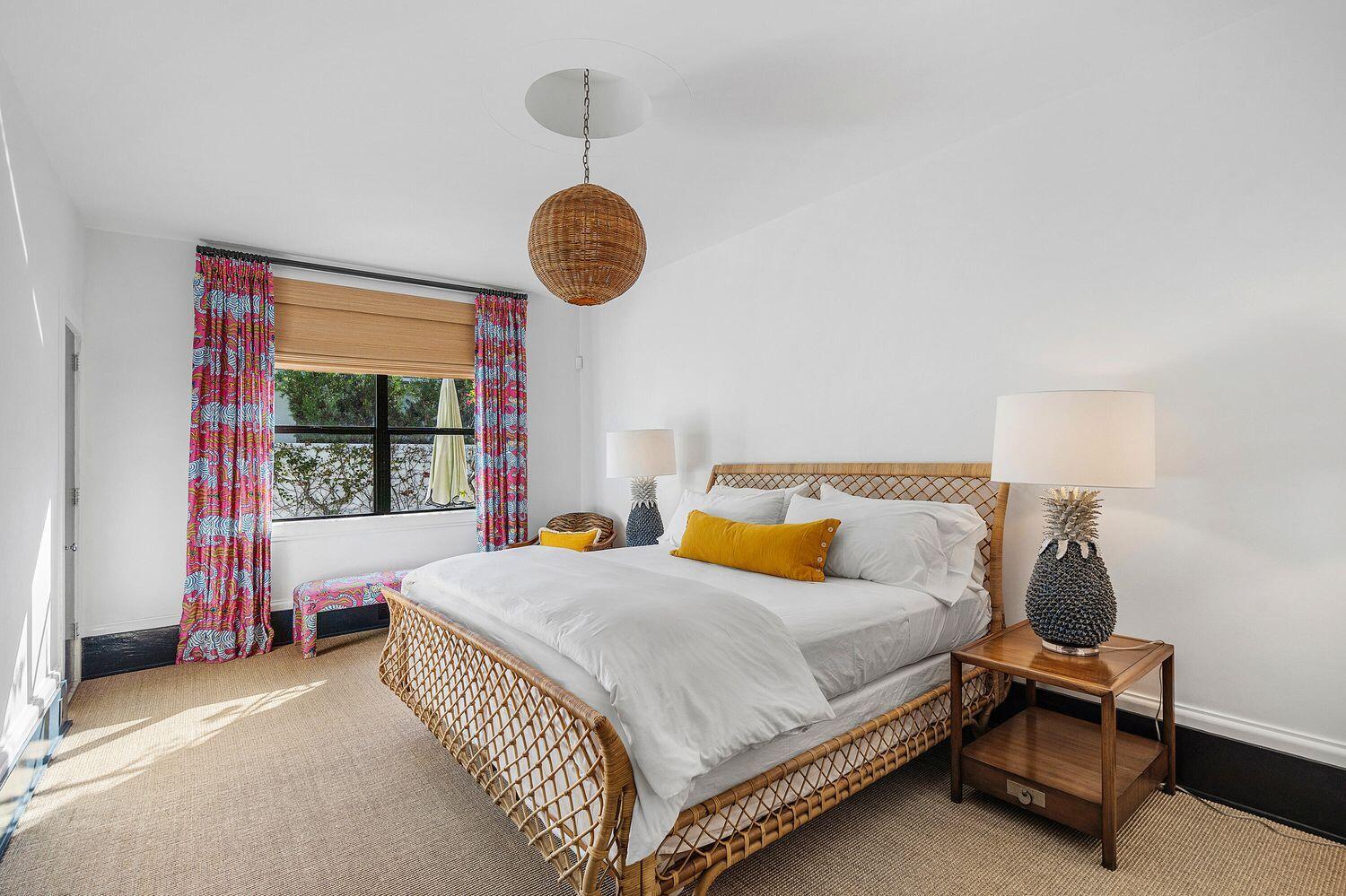 162 Peruvian Avenue Palm Beach, FL 33480 - Photo 23 of 41 a bedroom with a bed and a chandelier