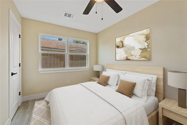 a bedroom with a bed and a window