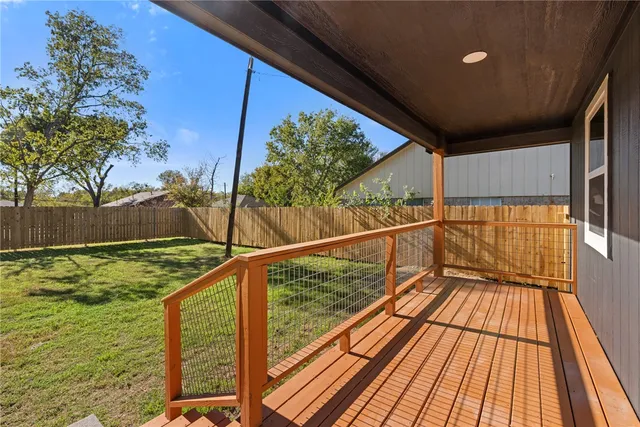a view of balcony with wooden floor