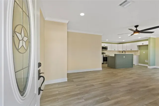 a view of a storage & utility room with a sink