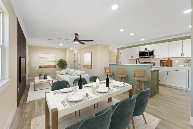 a view of a dining room with furniture window and wooden floor