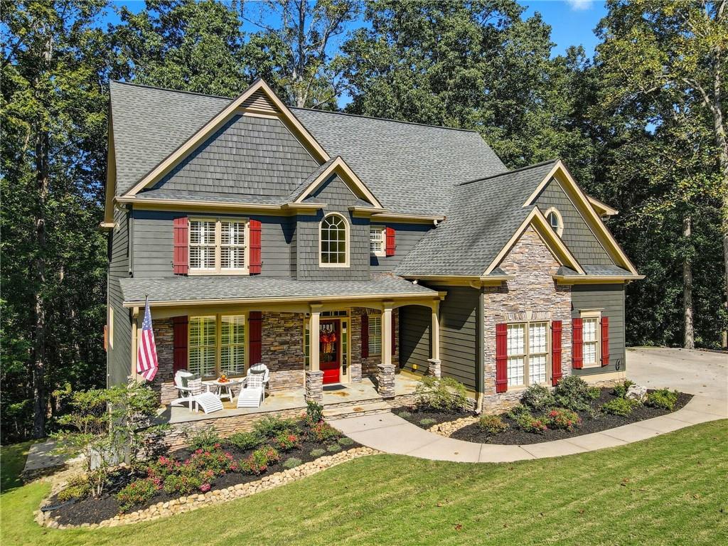a front view of a house with garden porch and patio