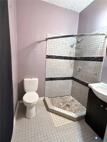 a bathroom with a toilet and a sink