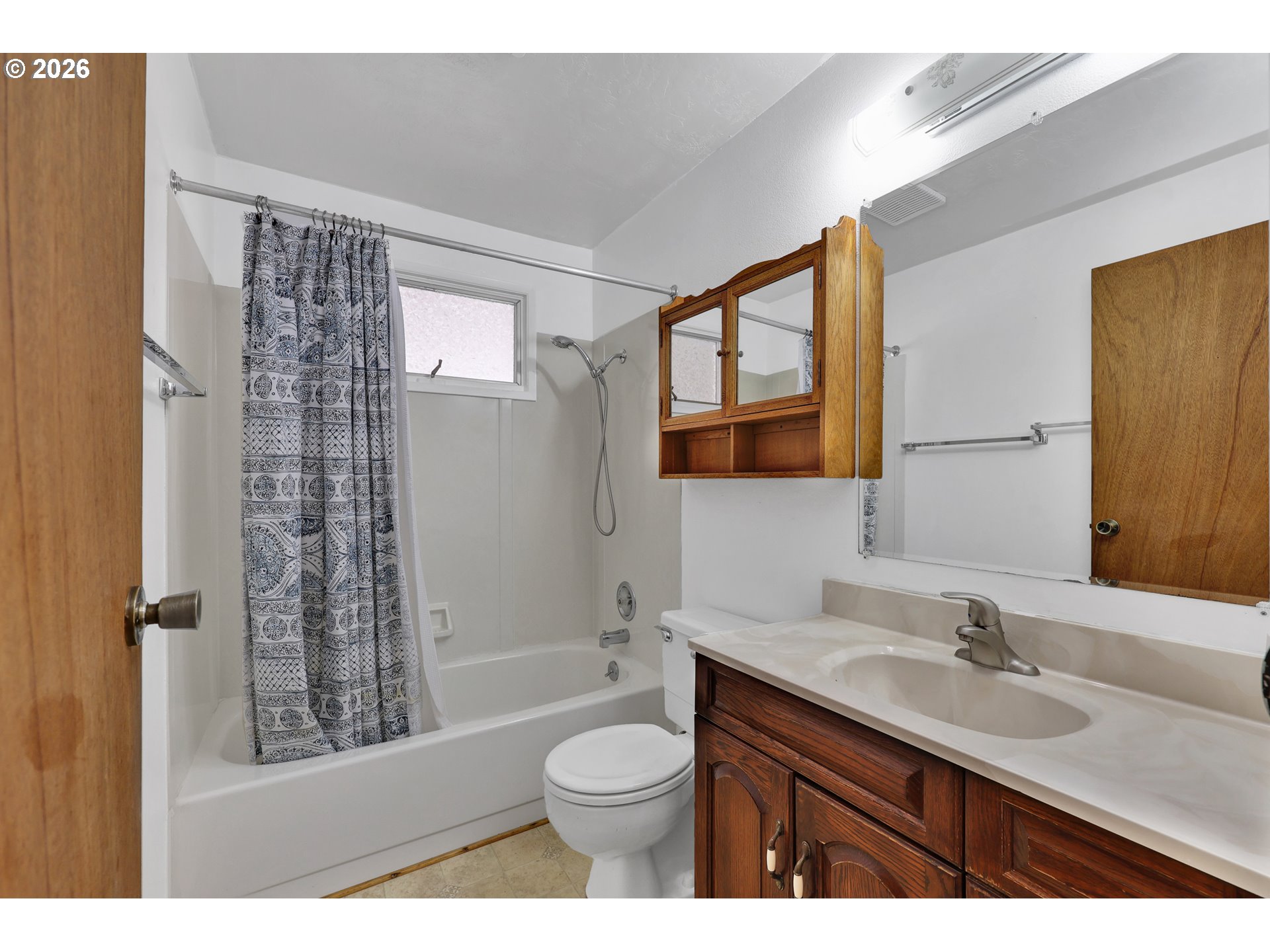 1425 Taney Street Eugene, OR 97402 - Photo 19 of 34 a bathroom with a sink a toilet and shower