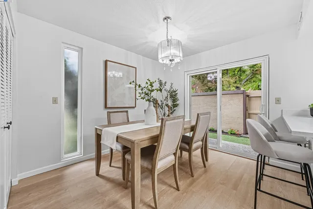 a view of a dining room with furniture window and outside view