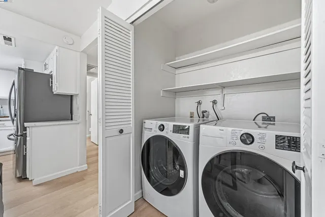 a utility room with dryer and washer