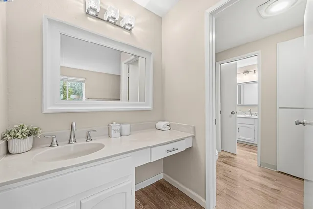 a bathroom with a sink double vanity and a mirror
