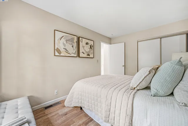 a bed room with bed and window