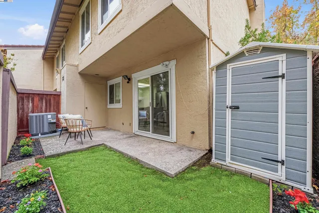 a view of a car park in front of house