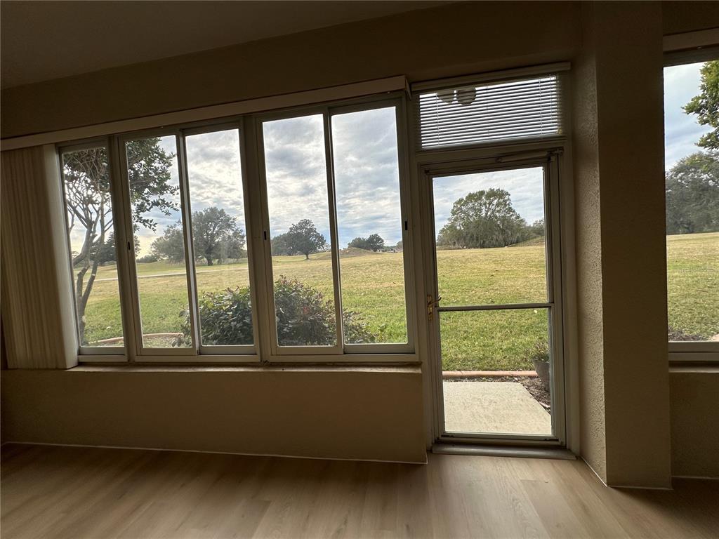 12900 Southeast 97th Terrace Road Summerfield, FL 34491 - Photo 12 of 28 a living room with a large window