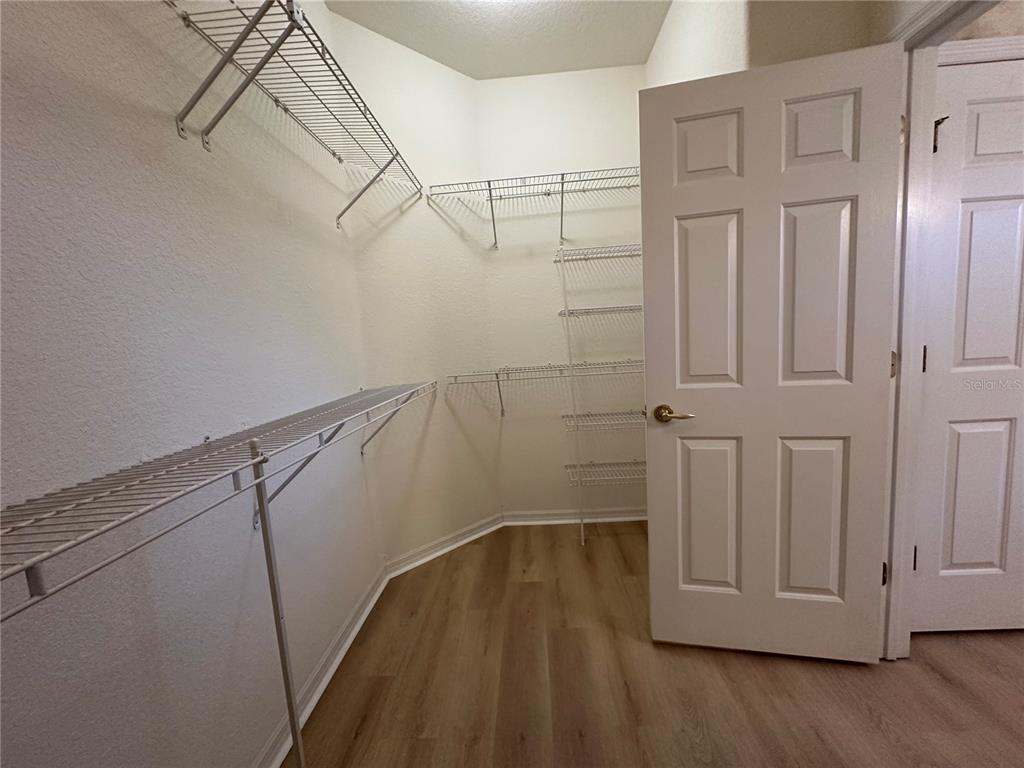12900 Southeast 97th Terrace Road Summerfield, FL 34491 - Photo 19 of 28 a view of a room with racks on the wall