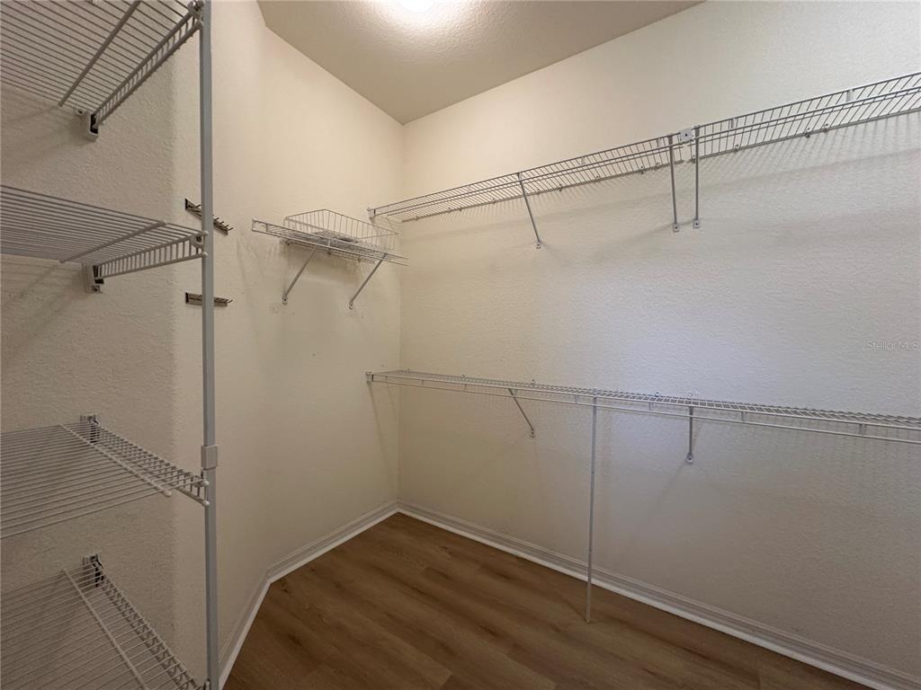 12900 Southeast 97th Terrace Road Summerfield, FL 34491 - Photo 20 of 28 a view of a room with racks on the wall