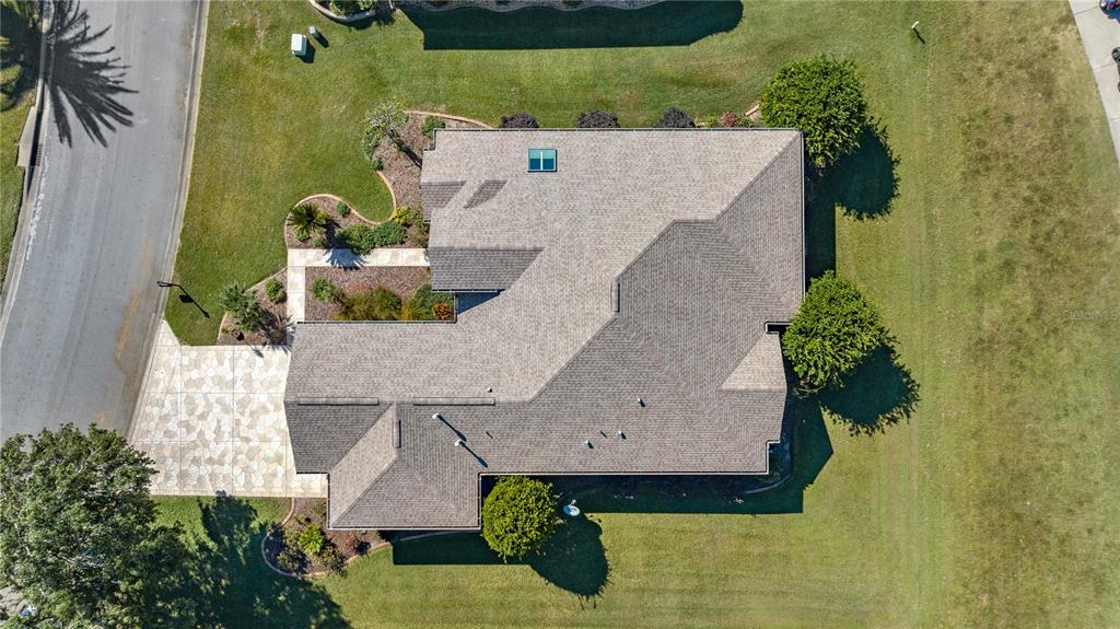 12900 Southeast 97th Terrace Road Summerfield, FL 34491 - Photo 4 of 28 an aerial view of a house with a garden