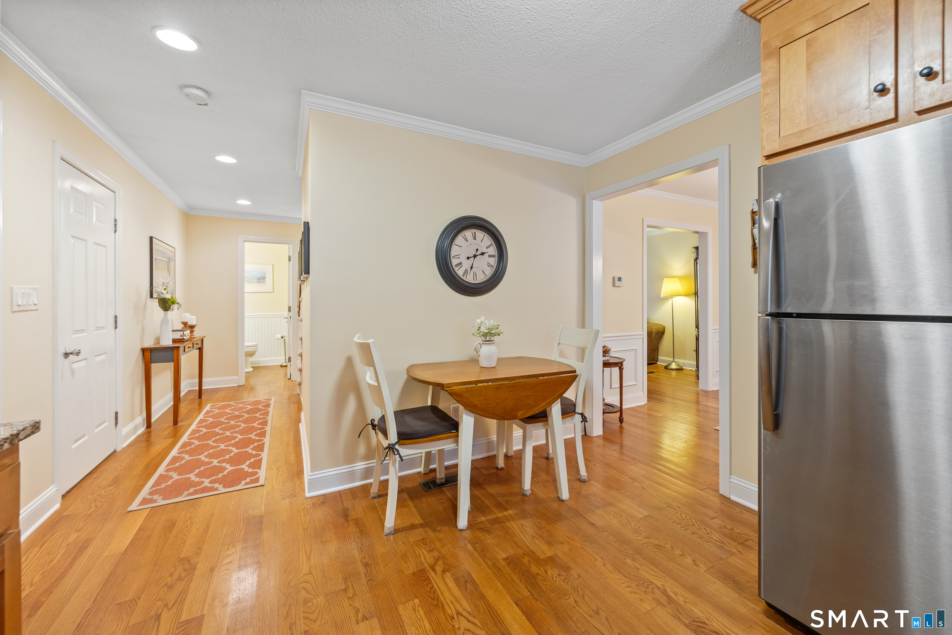 49 Quarry Village Road, Unit 49 Cheshire, CT 06410 - Photo 12 of 37 a view of a dining room with furniture and a wooden floor