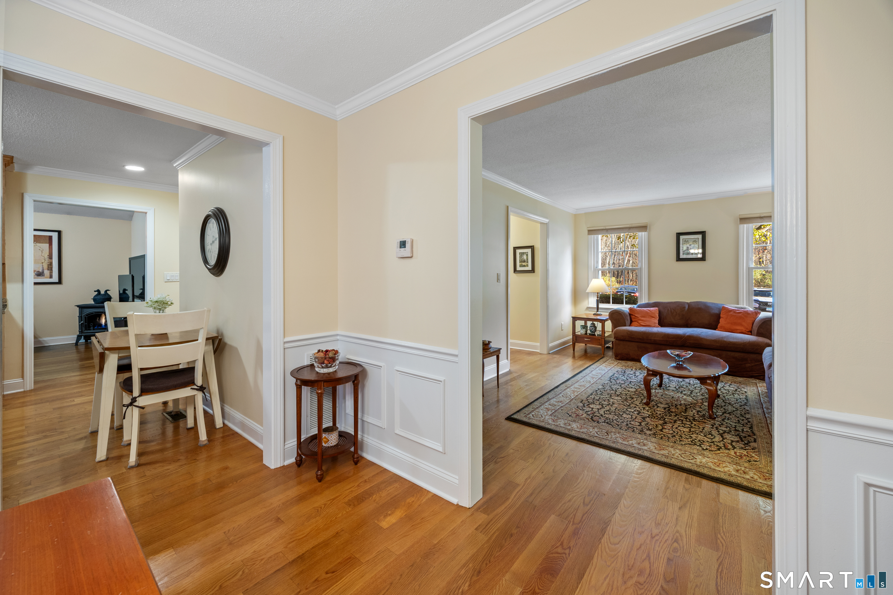 49 Quarry Village Road, Unit 49 Cheshire, CT 06410 - Photo 16 of 37 a living room with furniture and a wooden floor
