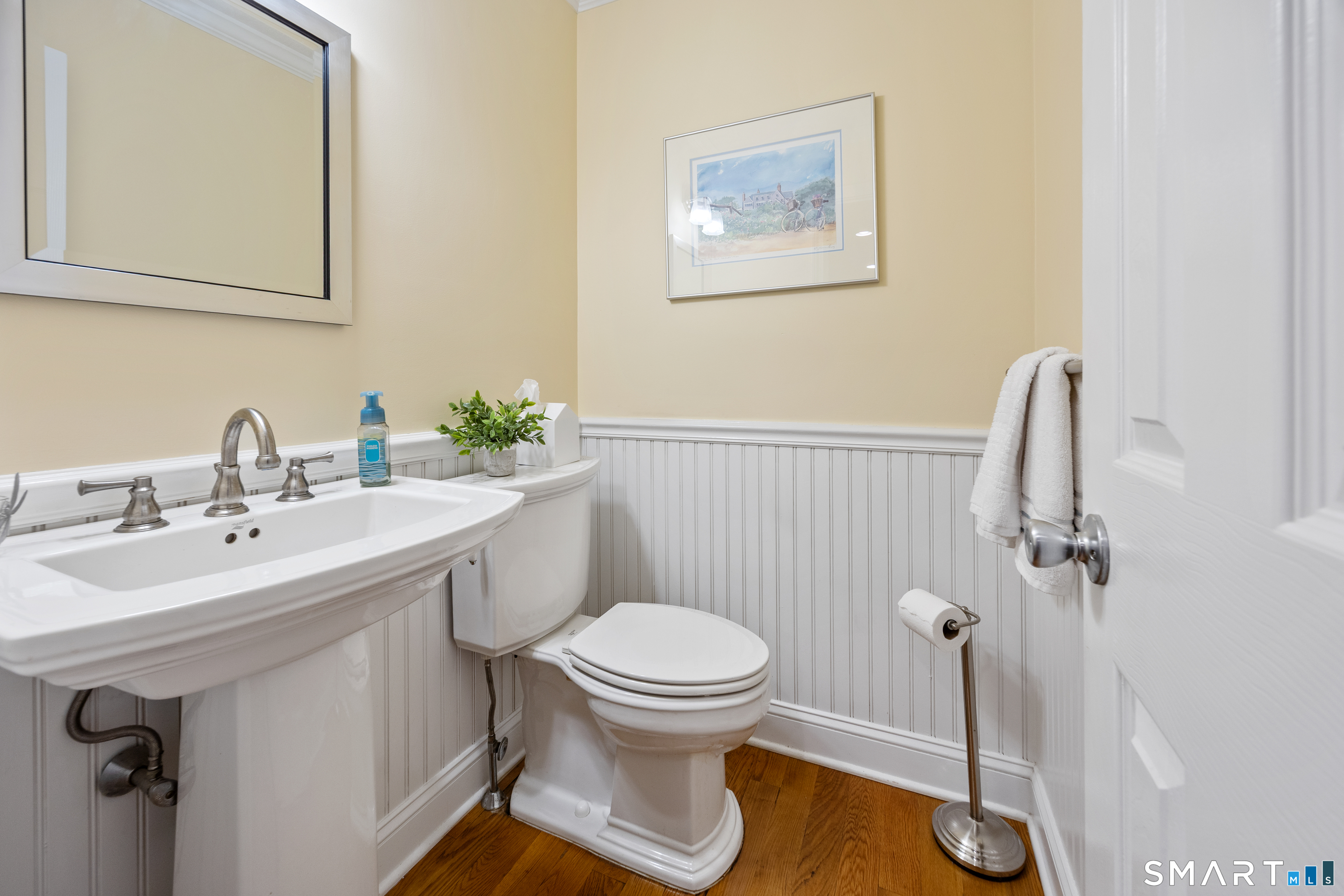 49 Quarry Village Road, Unit 49 Cheshire, CT 06410 - Photo 22 of 37 a bathroom with a sink a toilet and mirror