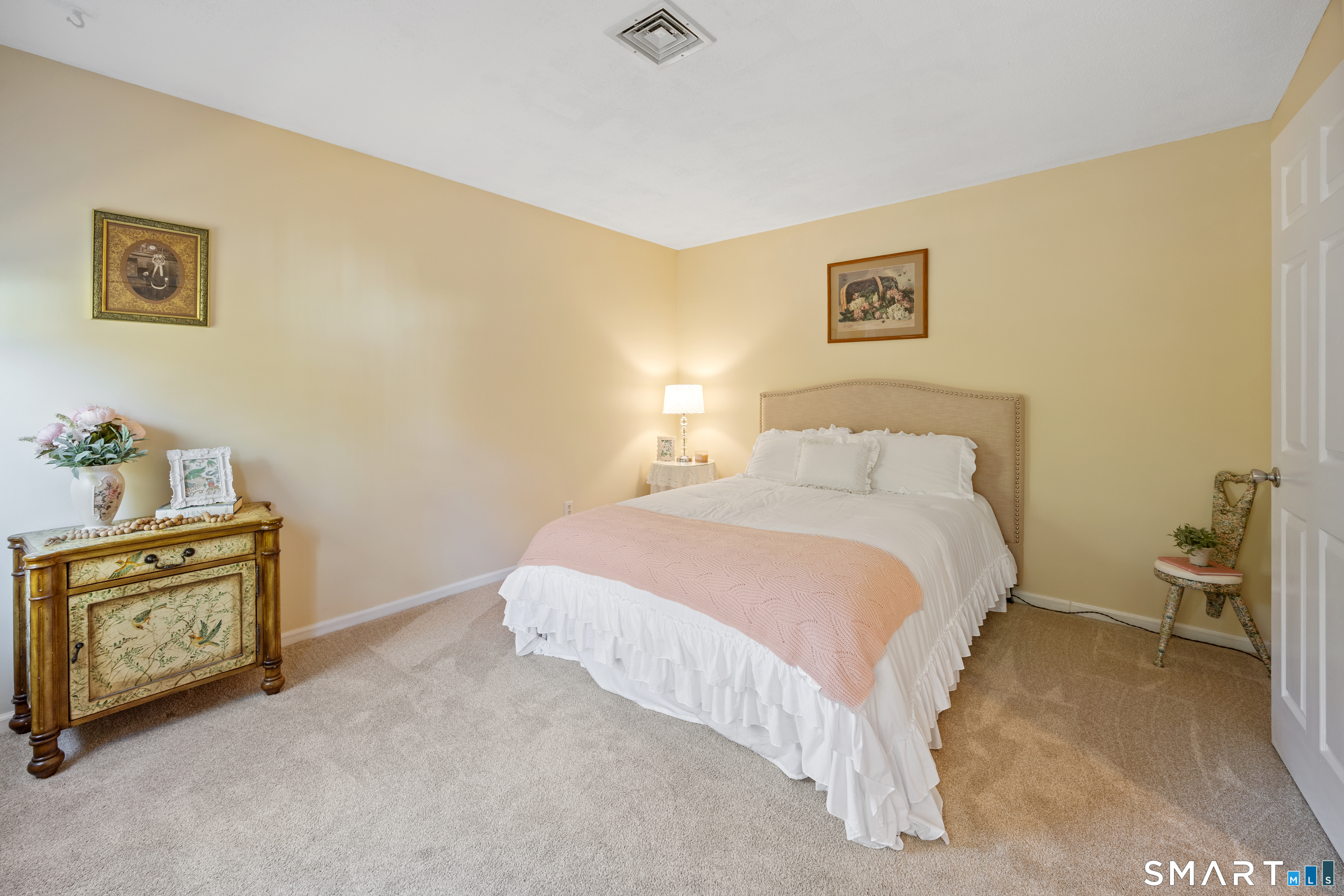 49 Quarry Village Road, Unit 49 Cheshire, CT 06410 - Photo 24 of 37 a bedroom with a bed and a couch