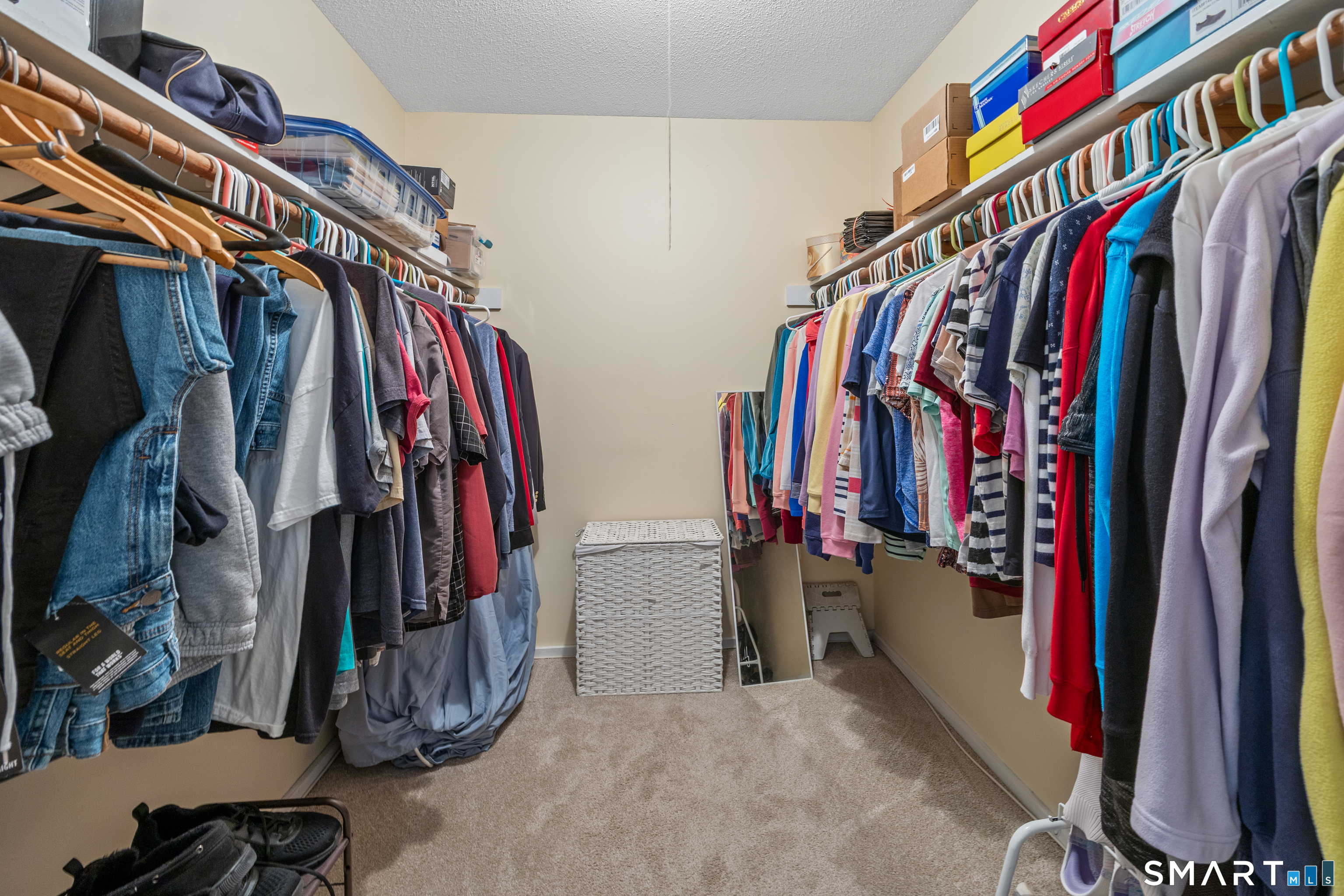 49 Quarry Village Road, Unit 49 Cheshire, CT 06410 - Photo 33 of 37 a view of walk in closet with clothes