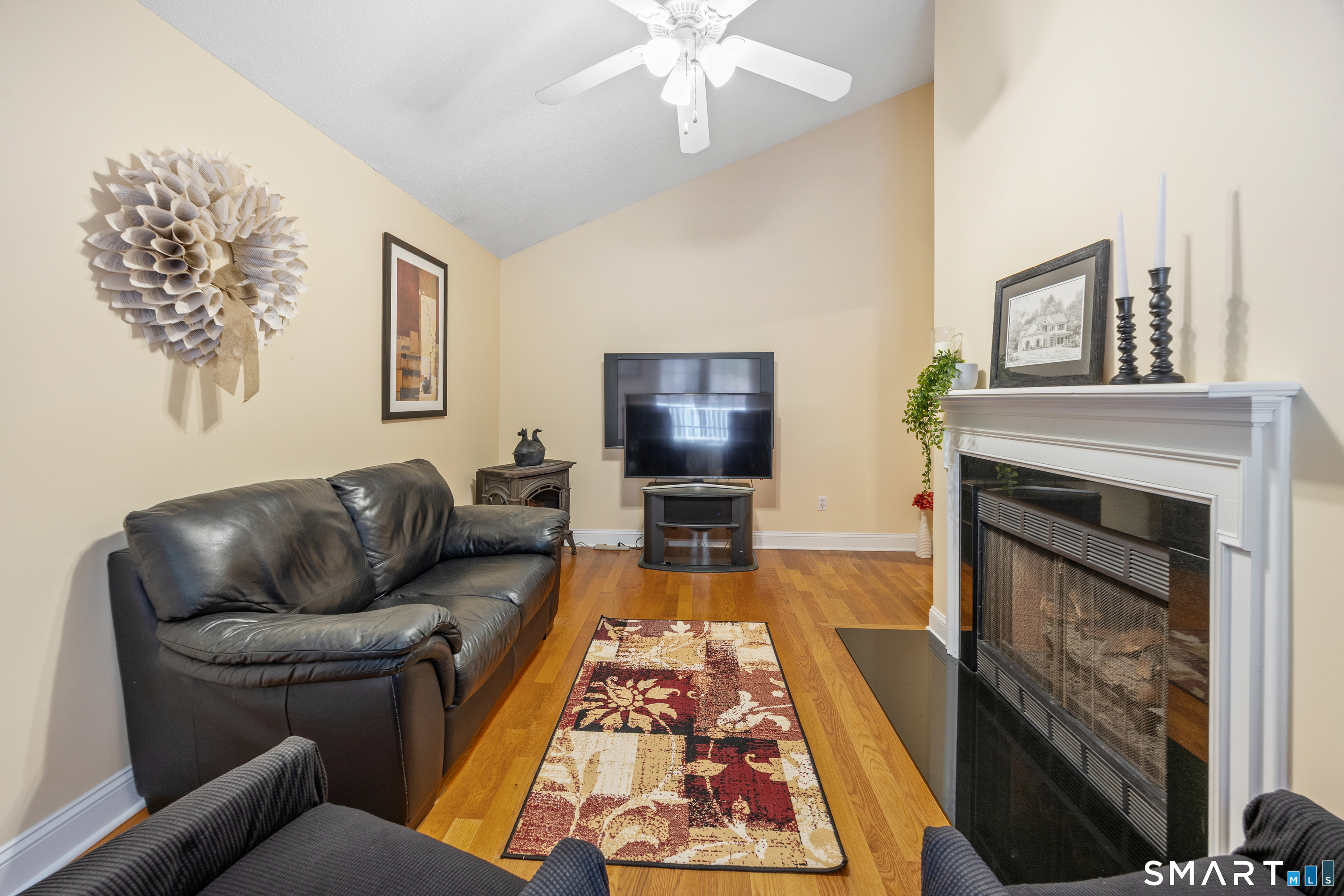 49 Quarry Village Road, Unit 49 Cheshire, CT 06410 - Photo 6 of 37 a living room with furniture and a fireplace