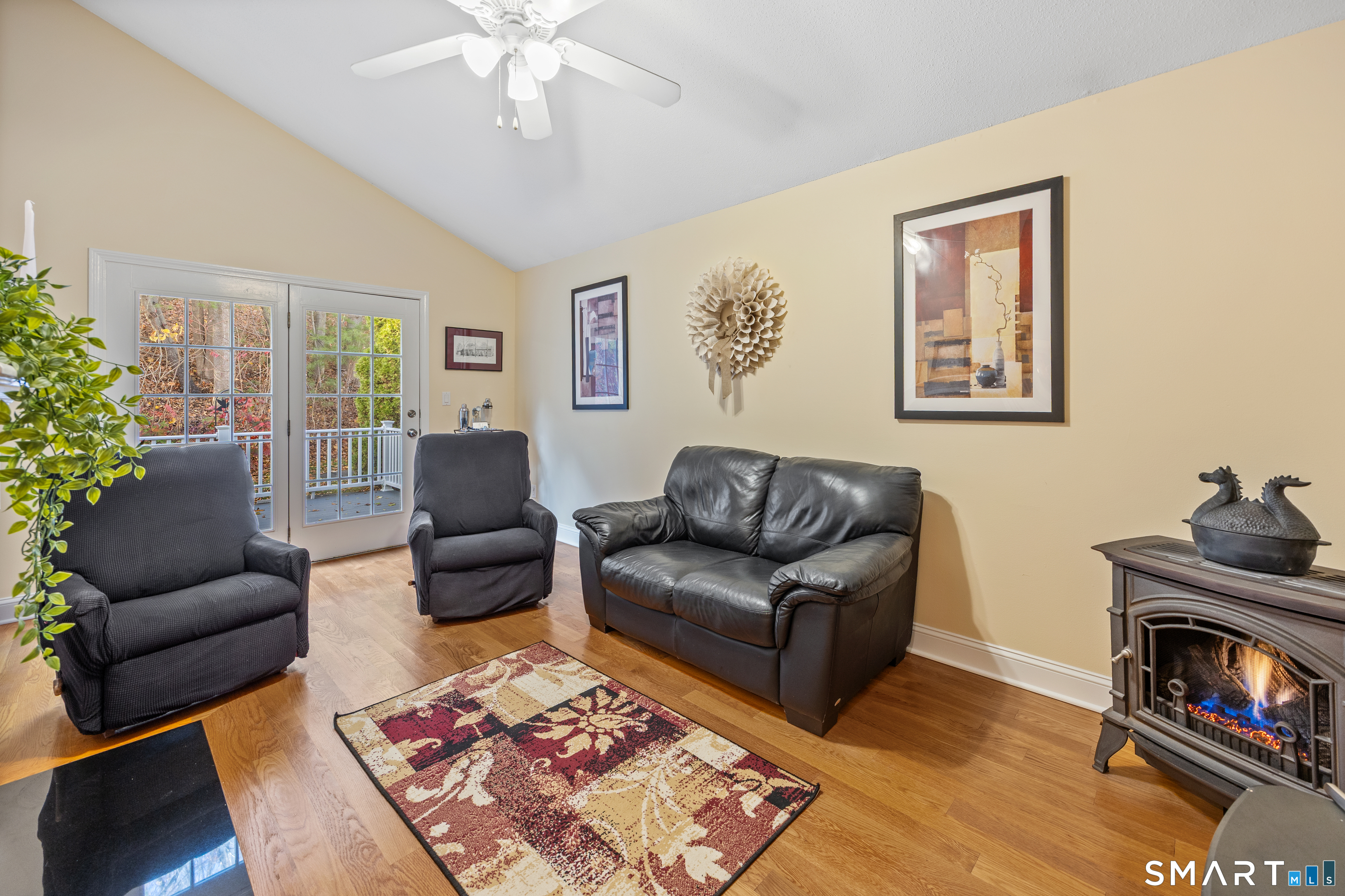 49 Quarry Village Road, Unit 49 Cheshire, CT 06410 - Photo 7 of 37 a living room with furniture and a fireplace