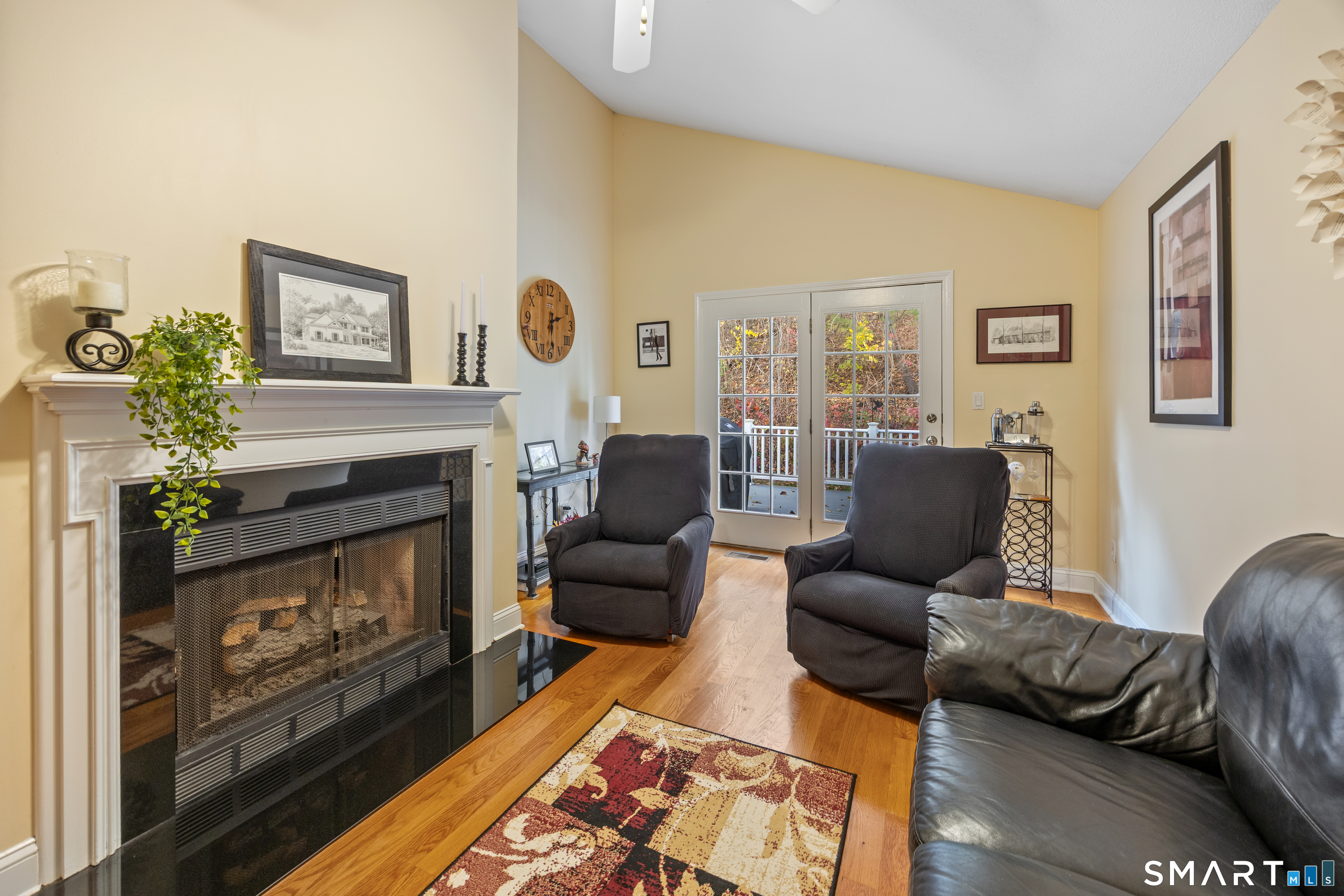 49 Quarry Village Road, Unit 49 Cheshire, CT 06410 - Photo 8 of 37 a living room with furniture and a fireplace