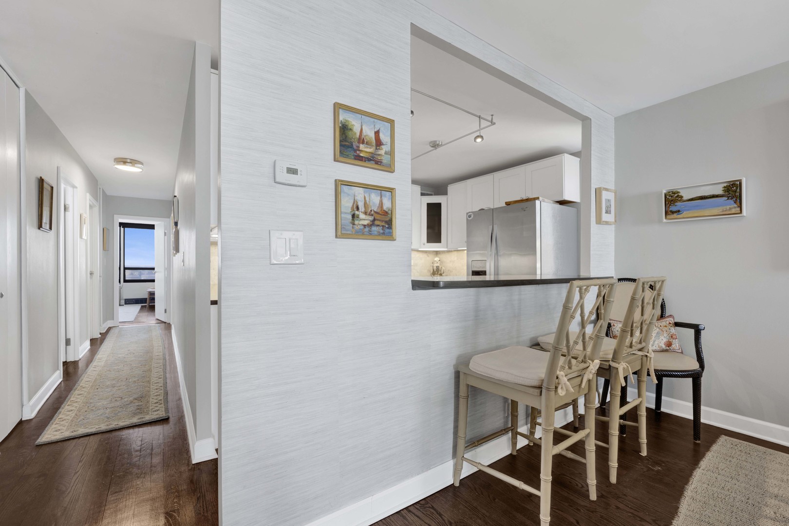 3150 North Sheridan Road, Unit 14A Chicago, IL 60657 - Photo 12 of 31 a view of a dining room with furniture and wooden floor