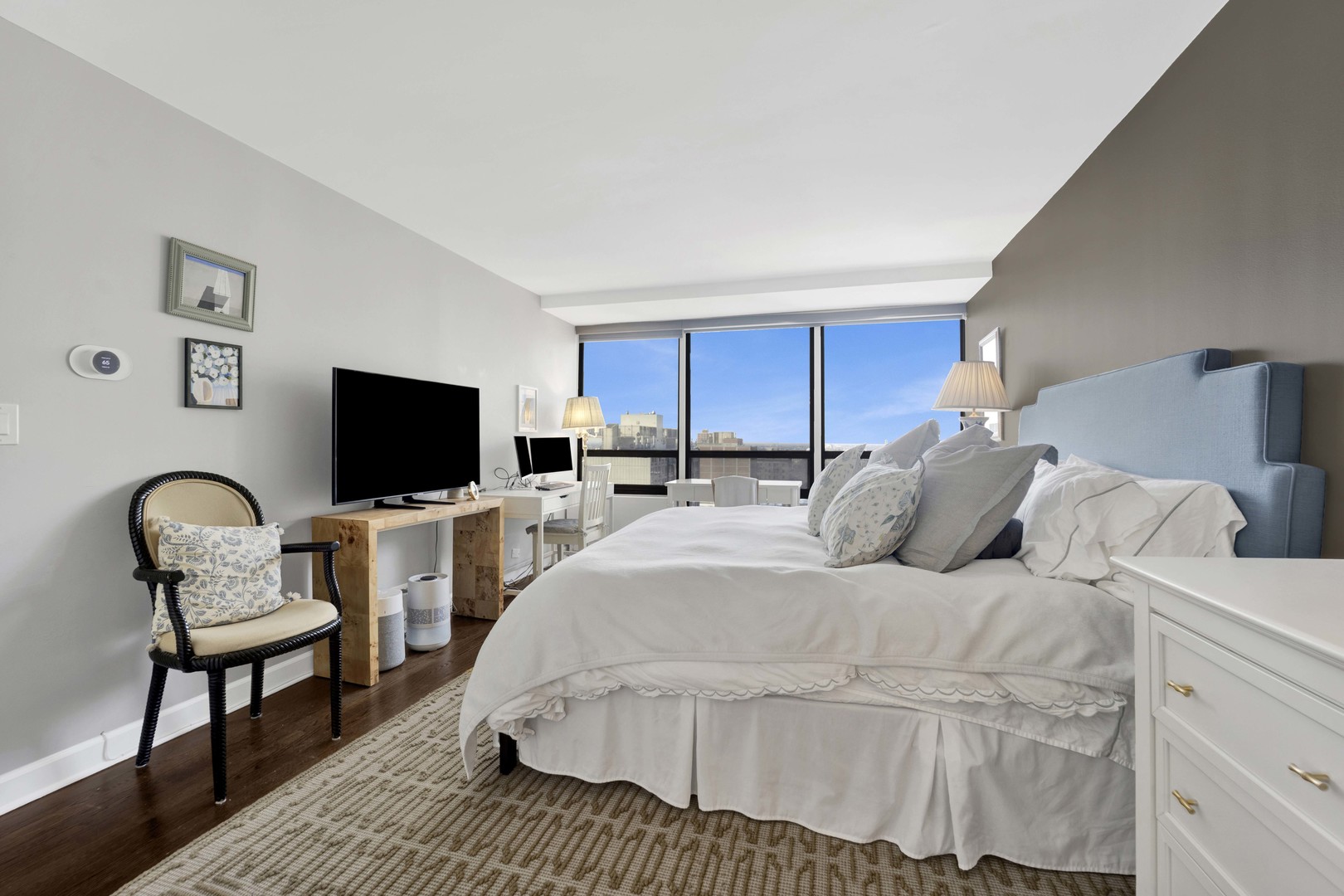 3150 North Sheridan Road, Unit 14A Chicago, IL 60657 - Photo 16 of 31 a bedroom with a bed and a chair
