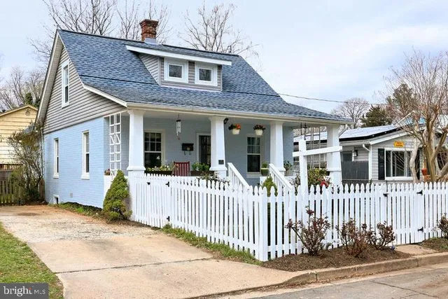 a front view of a house with a porch