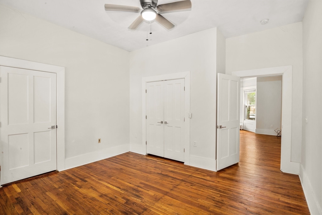 35 Oak Avenue Worcester, MA 01605 - Photo 11 of 34 an empty room with wooden floor and ceiling fan