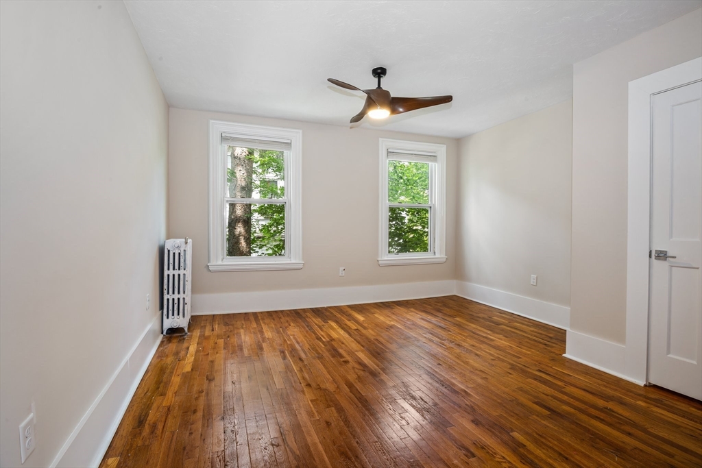 35 Oak Avenue Worcester, MA 01605 - Photo 15 of 34 a view of empty room with wooden floor and fan