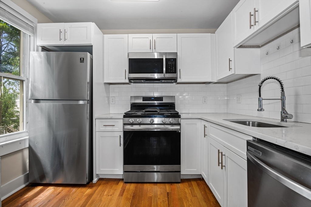 35 Oak Avenue Worcester, MA 01605 - Photo 17 of 34 a kitchen with a refrigerator and a sink