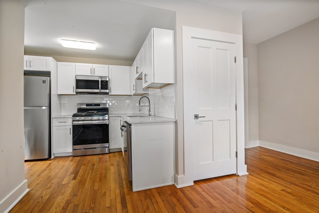 35 Oak Avenue Worcester, MA 01605 - Photo 21 of 34 a kitchen with stainless steel appliances a refrigerator and a stove top oven