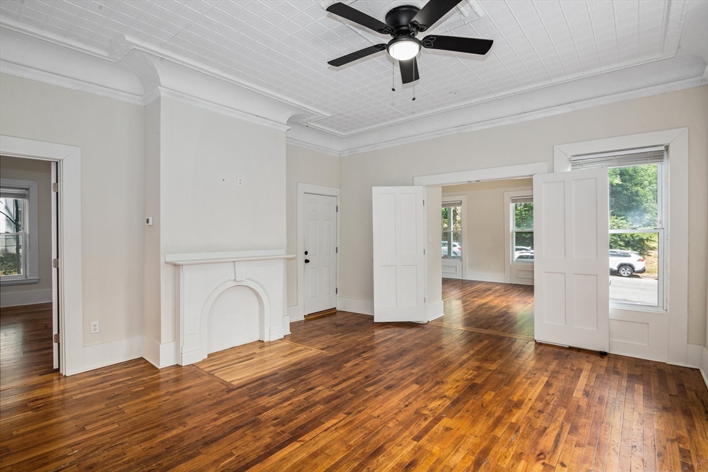 35 Oak Avenue Worcester, MA 01605 - Photo 6 of 34 a bedroom with a bed and a chandelier