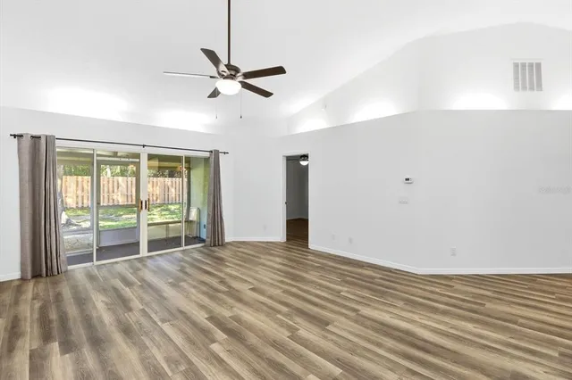 a view of an empty room with a window