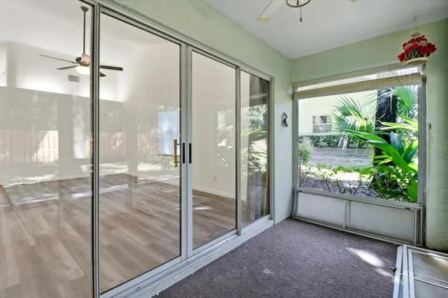 a view of a room with wooden floor and iron stairs