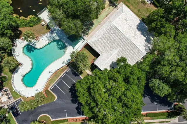 a view of a lake with couches in the patio