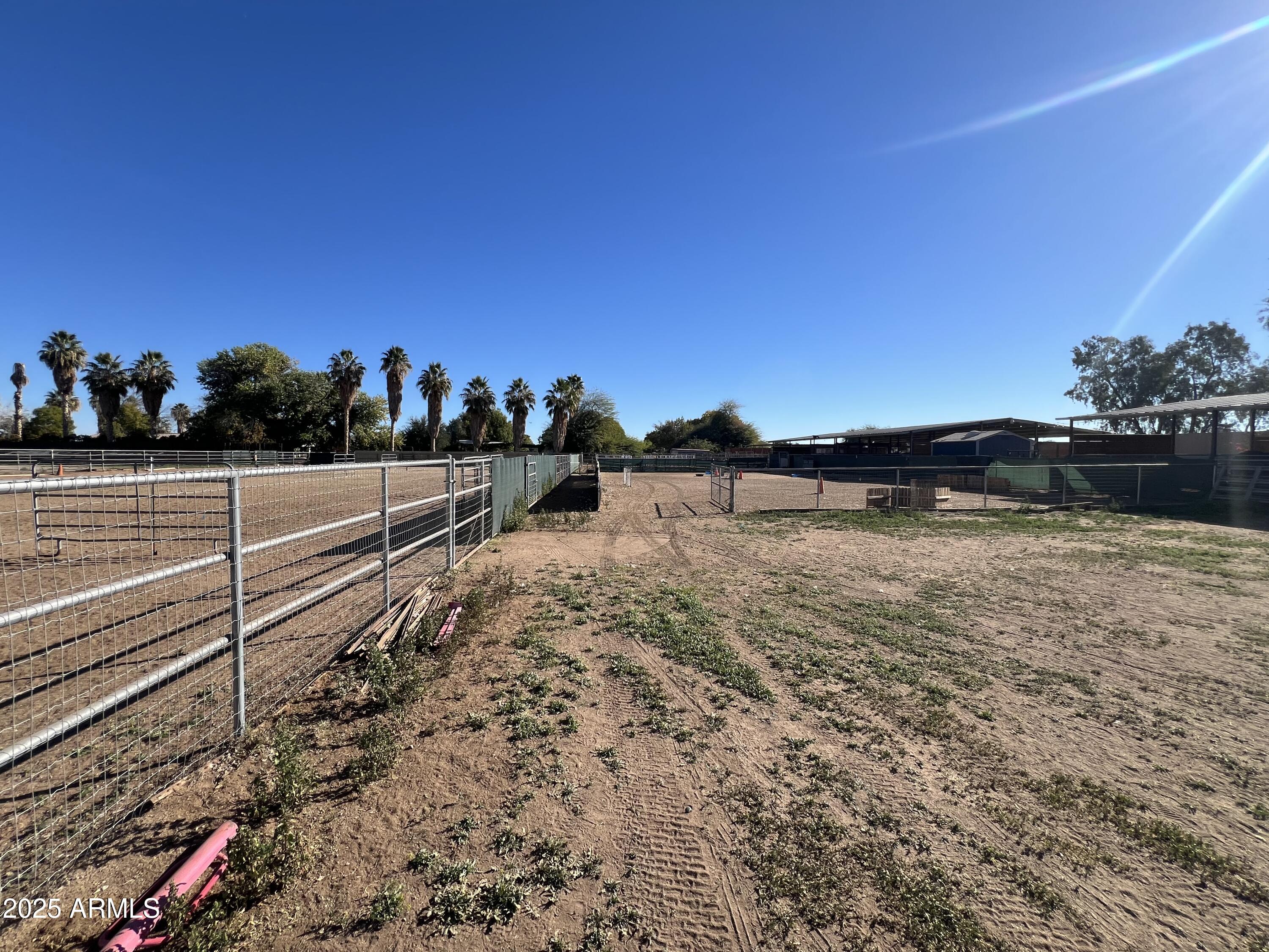 7431 North Alsup Road Litchfield Park, AZ 85340 - Photo 18 of 31 a view of a yard with wooden fence