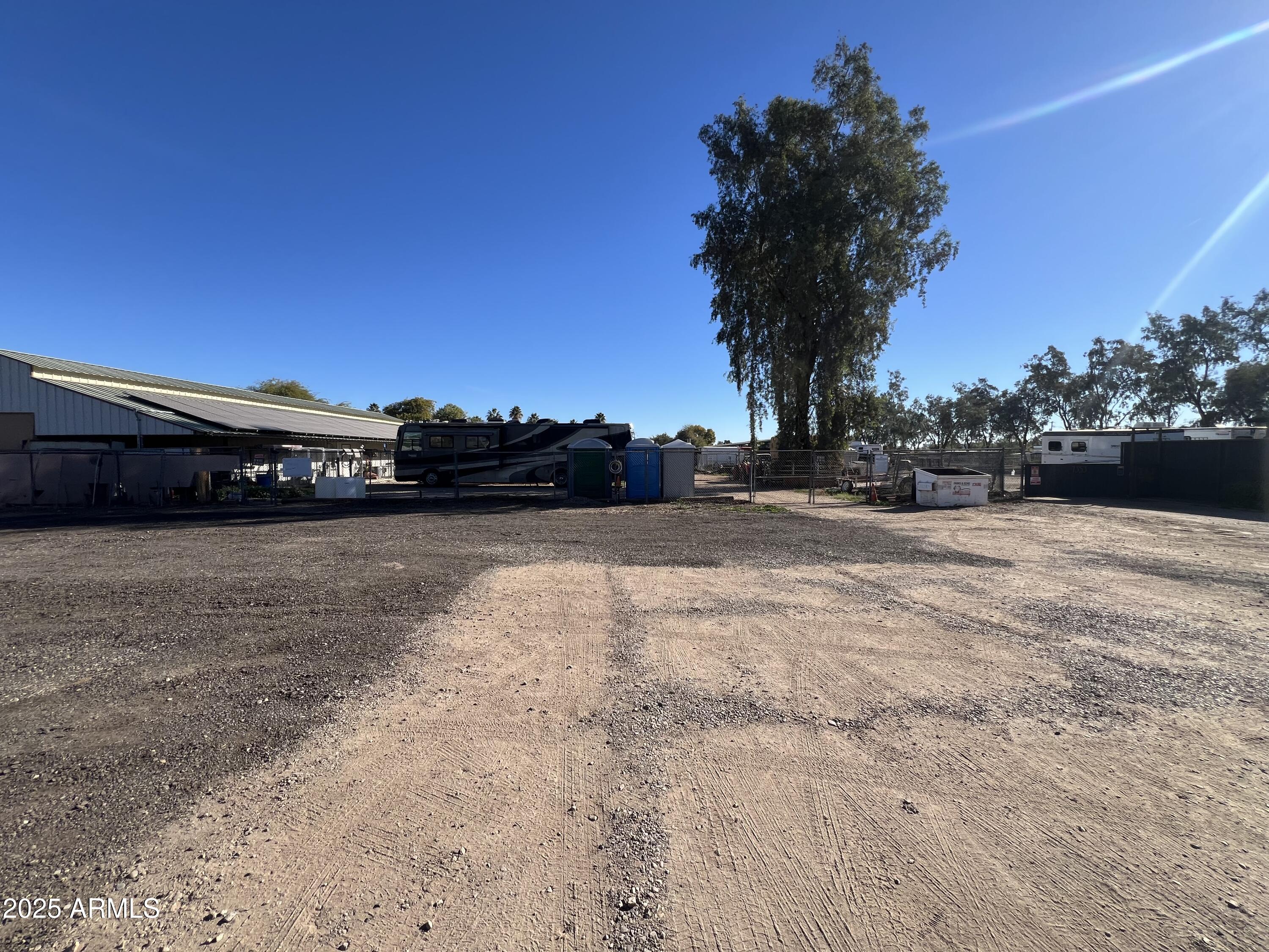 7431 North Alsup Road Litchfield Park, AZ 85340 - Photo 27 of 31 a view of car parked on the side of a road